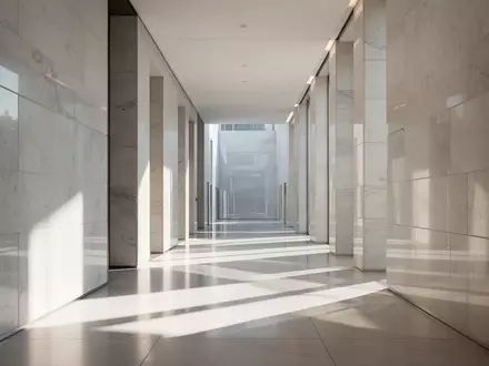 Ein heller, minimalistischer Flur in einem modernen Parlamentsgebäude mit klaren architektonischen Linien und natürlichem Lichteinfall. - Foto: über boerse-global.de