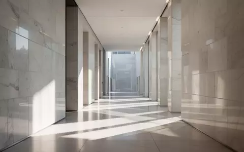 Ein heller, minimalistischer Flur in einem modernen Parlamentsgebäude mit klaren architektonischen Linien und natürlichem Lichteinfall. - Foto: über boerse-global.de
