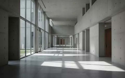 Leeres, minimalistisches Gebäudeinneres mit Betonarchitektur und einfallendem Tageslicht. - Foto: über boerse-global.de