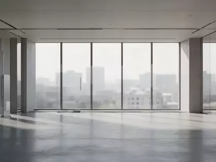 Ein minimalistisches, leeres Bürogebäude mit modernen architektonischen Linien und natürlichem Lichteinfall. - Foto: über boerse-global.de