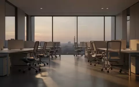 Ein modernes, leeres Büro mit aufgeräumten Arbeitsplätzen in der Dämmerung. - Foto: über boerse-global.de