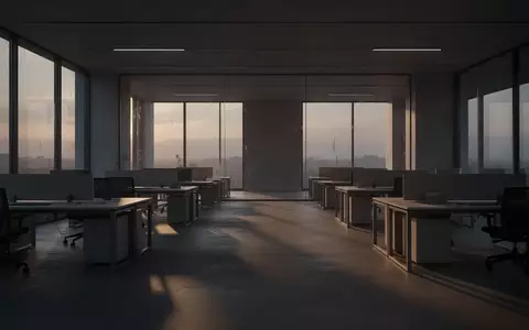 Leeres, modernes Büro am Abend mit langen Schatten und minimalistischen Schreibtischen in einer ruhigen Arbeitsumgebung. - Foto: über boerse-global.de