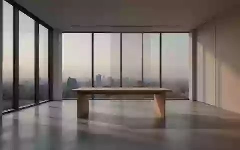 Ein minimalistisches, leeres Büro mit großen Fenstern und sanftem Tageslicht, das eine Atmosphäre von Ruhe und Klarheit vermittelt. - Foto: über boerse-global.de