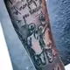 Die Brüder Mario und Luka Vuskovic als Tattoo verewigt auf dem Unterarm von Luka. (Archivbild)   - Bild: Christian Charisius/dpa