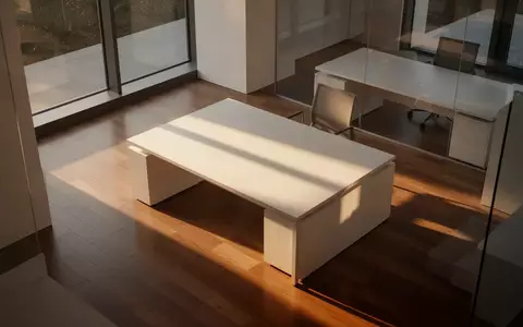 Ein minimalistisch gestalteter, leerer Büroraum mit architektonischen Schatten und natürlichem Lichteinfall. - Foto: über boerse-global.de