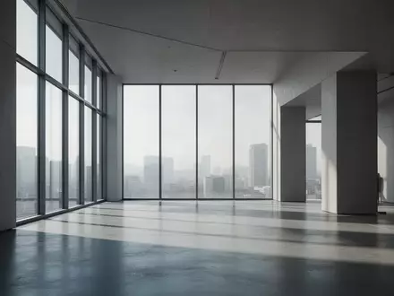 Minimalistischer, moderner Innenraum mit klaren architektonischen Linien und natürlichem Lichteinfall durch große Fenster. - Foto: über boerse-global.de