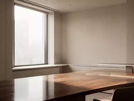 Ein minimalistischer, moderner Arbeitsbereich mit klaren architektonischen Linien und sanftem Tageslicht. - Foto: über boerse-global.de