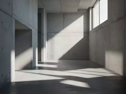 Minimalistische Architektur mit geometrischen Schattenwürfen in einem leeren, lichtdurchfluteten Flur. - Foto: über boerse-global.de