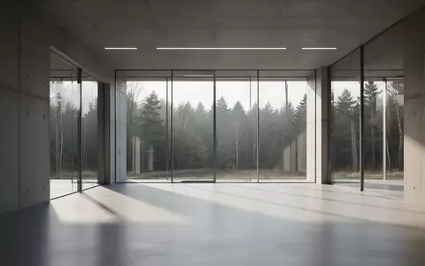 Modernes Forschungsgebäude mit minimalistischer Architektur und Blick in eine bewaldete Landschaft. - Foto: über boerse-global.de