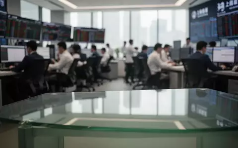 Ein verschwommener Blick auf ein modernes Handelszentrum mit Fokus auf einen leeren Schreibtisch im Vordergrund. - Foto: über boerse-global.de