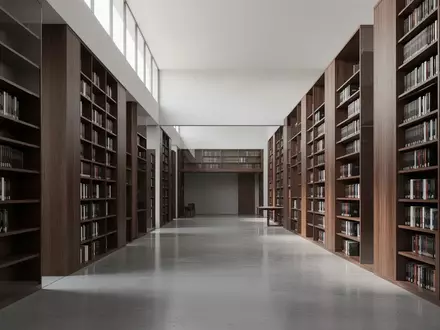 Ein moderner, minimalistischer Bibliotheksraum mit hohen Holzregalen und poliertem Betonboden in hellem Tageslicht. - Foto: über boerse-global.de