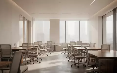 Ein minimalistisch gestalteter, heller Büroraum mit leeren Arbeitsplätzen und natürlichem Lichteinfall. - Foto: über boerse-global.de