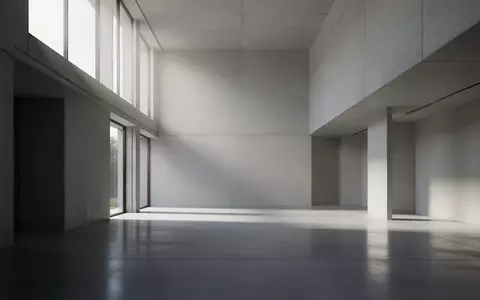 Ein minimalistischer, leerer Architekturraum mit klaren Linien und hellem, natürlichem Tageslicht. - Foto: über boerse-global.de