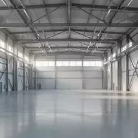 Helle, minimalistische Produktionshalle mit klaren architektonischen Linien und natürlichem Lichteinfall. - Foto: über boerse-global.de