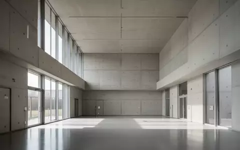 Ein minimalistischer, moderner Forschungsraum mit hohen Decken und klaren Linien, beleuchtet durch natürliches Tageslicht. - Foto: über boerse-global.de