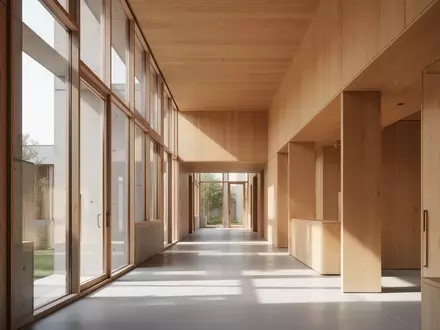 Ein lichtdurchfluteter, moderner Innenraum mit klaren architektonischen Linien und warmen Holzelementen. - Foto: über boerse-global.de