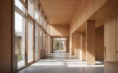 Ein lichtdurchfluteter, moderner Innenraum mit klaren architektonischen Linien und warmen Holzelementen. - Foto: über boerse-global.de