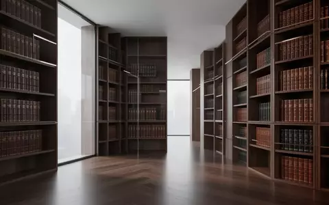 Ein minimalistischer, moderner Innenraum einer Anwaltskanzlei mit hohen Holzregalen voller juristischer Fachliteratur. - Foto: über boerse-global.de
