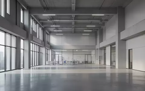 Ein minimalistisch gestaltetes, modernes Forschungsgebäude mit hohen Decken und polierten Betonböden in einer hellen, ruhigen Umgebung. - Foto: über boerse-global.de