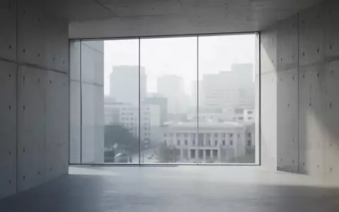 Ein minimalistisch gestalteter Flur in einem modernen Verwaltungsgebäude mit klaren Linien und hellem Tageslicht. - Foto: über boerse-global.de