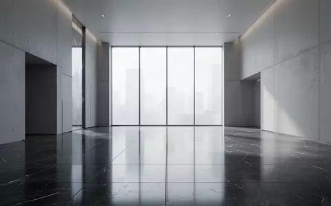 Ein minimalistischer, leerer Innenraum eines modernen Finanzgebäudes mit poliertem Steinboden und natürlichem Lichteinfall. - Foto: über boerse-global.de