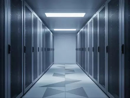 Ein minimalistischer, moderner Serverraum mit bläulicher Beleuchtung und geometrischen Strukturen. - Foto: über boerse-global.de