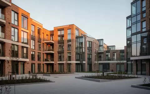 Moderne Wohnanlage mit klarer Architektur bei Sonnenlicht. - Foto: über boerse-global.de