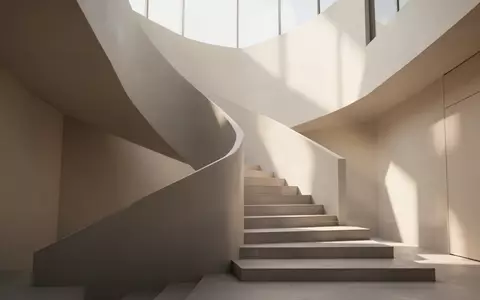 Ein minimalistisches, helles Treppenhaus in einem modernen Gebäude, das Stabilität und langfristigen Fortschritt symbolisiert. - Foto: über boerse-global.de