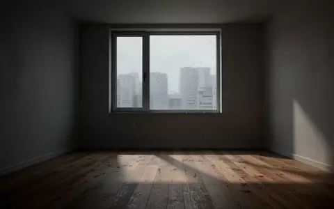 Ein leerer, minimalistischer Wohnraum bei gedämpftem Tageslicht, der eine melancholische und ruhige Atmosphäre ausstrahlt. - Foto: über boerse-global.de