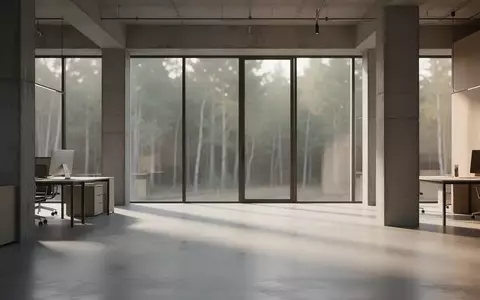 Ein minimalistischer, moderner Industrieraum mit poliertem Betonboden und natürlichem Licht, das durch große Fenster fällt. - Foto: über boerse-global.de