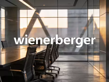 Modernes, minimalistisches Bürogebäude bei goldenem Licht als Symbol für einen Führungswechsel in der Industrie. - Foto: über boerse-global.de