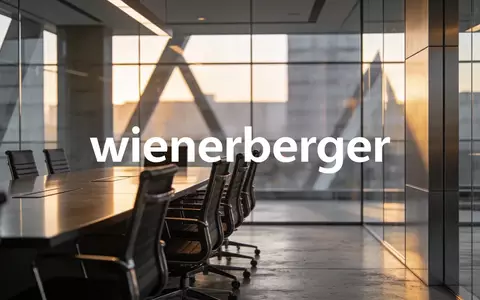 Modernes, minimalistisches Bürogebäude bei goldenem Licht als Symbol für einen Führungswechsel in der Industrie. - Foto: über boerse-global.de