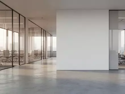 Ein minimalistisch gestalteter, moderner Bürokomplex mit klaren Linien und hellem, natürlichem Lichteinfall. - Foto: über boerse-global.de