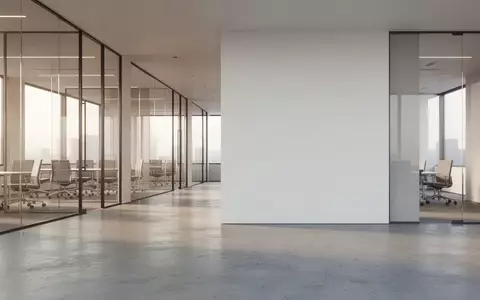 Ein minimalistisch gestalteter, moderner Bürokomplex mit klaren Linien und hellem, natürlichem Lichteinfall. - Foto: über boerse-global.de