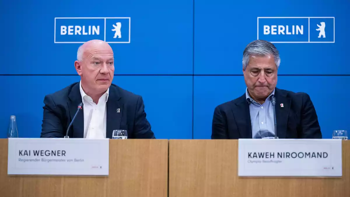 Berlins Regierender Bürgermeister Kai Wegner (l) und der Olympia-Beauftragte Kaweh Niroomand erklärten den Rückzug bei der Olympia-Bewerbung. - Bild: Christophe Gateau/dpa