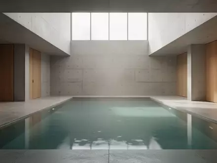 Ein minimalistisch gestalteter Innenraum mit einem ruhigen Wasserbecken, das für eine meditative und beruhigende Atmosphäre sorgt. - Foto: über boerse-global.de