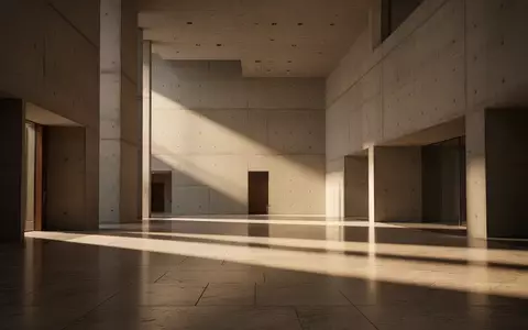 Ein minimalistischer, moderner Innenraum eines öffentlichen Gebäudes mit Betonwänden und natürlichem Lichteinfall. - Foto: über boerse-global.de