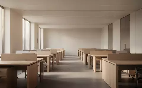 Ein minimalistisches, leeres Büro mit modernen Schreibtischen und natürlichem Lichteinfall. - Foto: über boerse-global.de