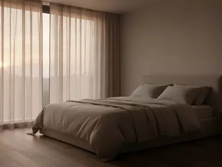 Ein minimalistisch eingerichtetes Schlafzimmer in den frühen Morgenstunden mit sanftem, einfallendem Tageslicht. - Foto: über boerse-global.de