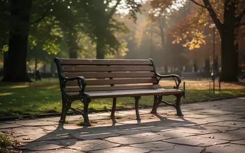 Eine leere Parkbank in einem sonnendurchfluteten Park, die Ruhe und den Wunsch nach sozialer Verbindung symbolisiert. - Foto: über boerse-global.de