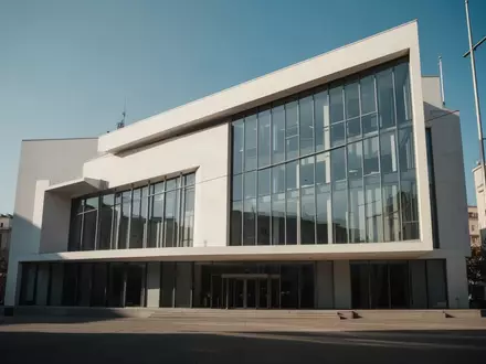 Moderne Fassade eines Verwaltungsgebäudes bei klarem Himmel. - Foto: über boerse-global.de