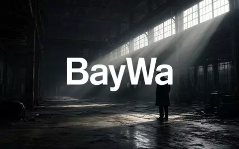 Abstrakte Darstellung einer industriellen Lagerhalle in gedimmtem Licht, die eine angespannte wirtschaftliche Stimmung vermittelt. - Foto: über boerse-global.de