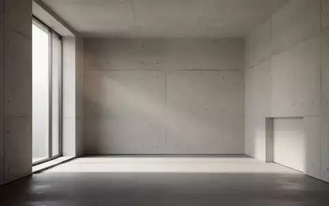 Ein minimalistischer, architektonischer Innenraum mit klaren Linien und diffusem Tageslicht, ohne technische Geräte. - Foto: über boerse-global.de