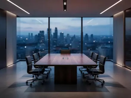 Ein minimalistischer, moderner Konferenzraum bei Dämmerung mit Blick auf eine verschwommene Stadtlandschaft. - Foto: über boerse-global.de
