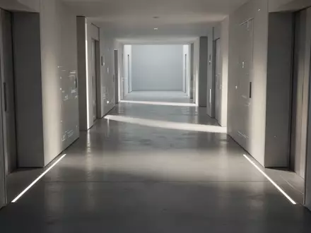 Ein minimalistischer, modern gestalteter Flur mit weichem Lichteinfall und klaren architektonischen Linien. - Foto: über boerse-global.de