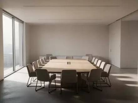 Ein minimalistischer, leerer Konferenzraum mit natürlichem Lichteinfall, der eine ruhige und professionelle Atmosphäre vermittelt. - Foto: über boerse-global.de