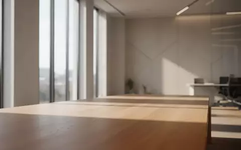 Ein minimalistischer, moderner Innenraum mit natürlichem Licht, das auf eine leere Holzoberfläche fällt. - Foto: über boerse-global.de