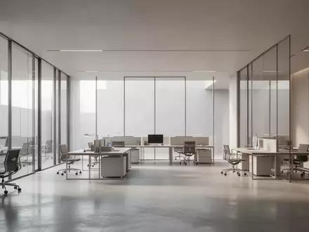 Ein minimalistischer, moderner Arbeitsbereich mit klaren Linien und hellem Tageslicht in einem architektonisch schlichten Raum. - Foto: über boerse-global.de