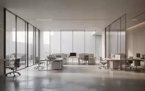 Ein minimalistischer, moderner Arbeitsbereich mit klaren Linien und hellem Tageslicht in einem architektonisch schlichten Raum. - Foto: über boerse-global.de