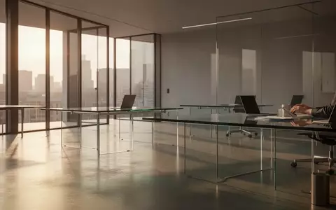 Ein minimalistisch gestalteter, moderner Büroraum mit klaren Linien und natürlichem Lichteinfall. - Foto: über boerse-global.de